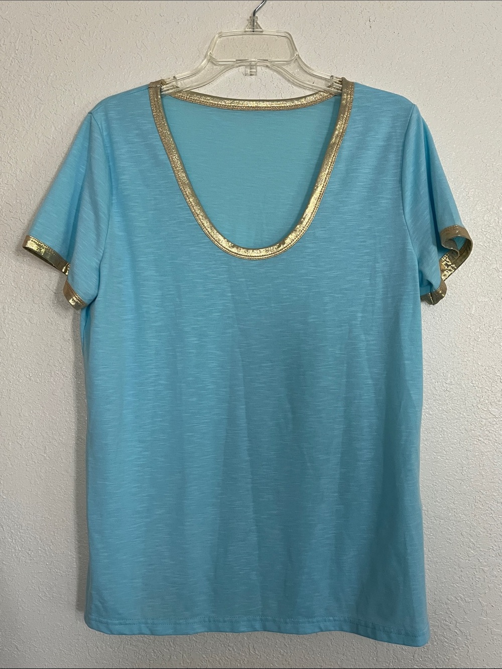 Size Large turquoise blue with metallic gold trim Tshirt.